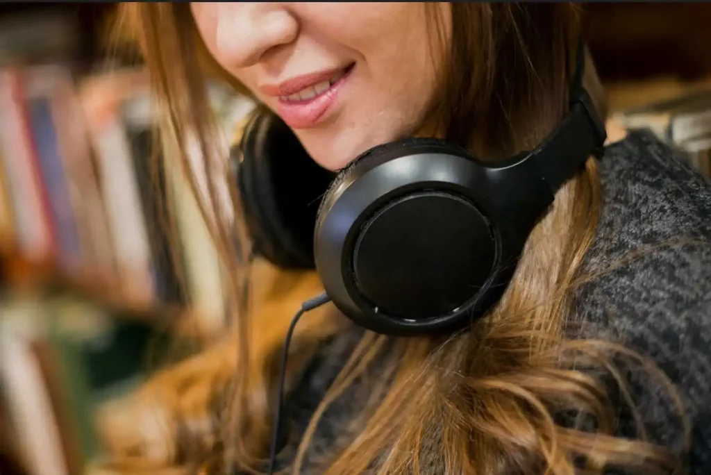 Girl smiling while wearing headphones