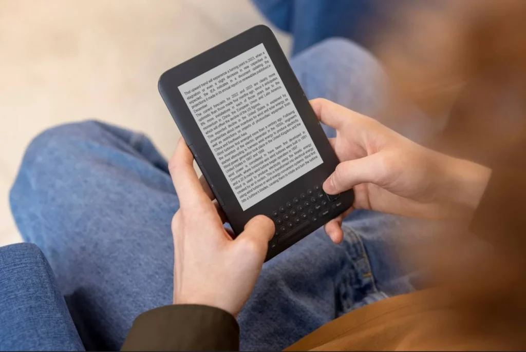 tablet and books on wooden desk